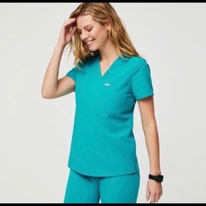 Large Figs Catarina scrub top and Large Petite Figs Kade cargo pants.